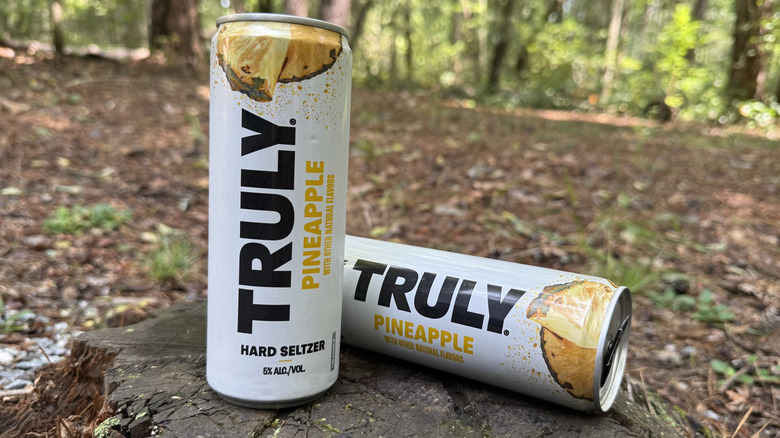 Two cans of pineapple Truly seltzer