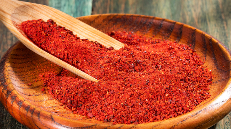 bright annatto seeds on dish
