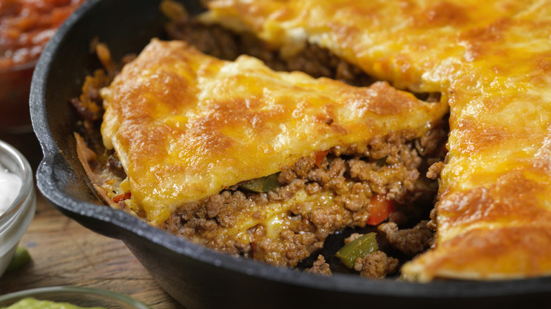 taco pie in a cast iron skillet
