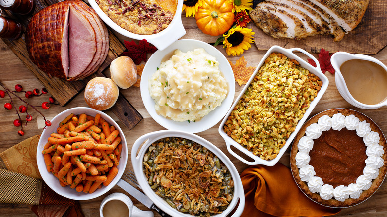 Thanksgiving table with lots of vintage side dishes