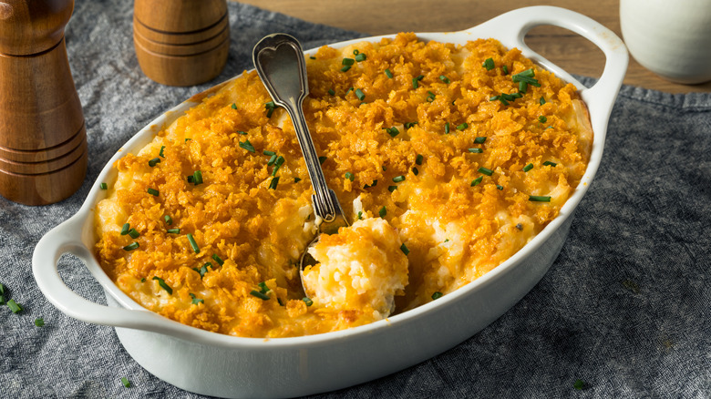potato casserole with breadcrumb topping and chives