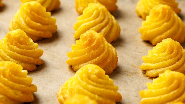 potato puffs on a baking sheet
