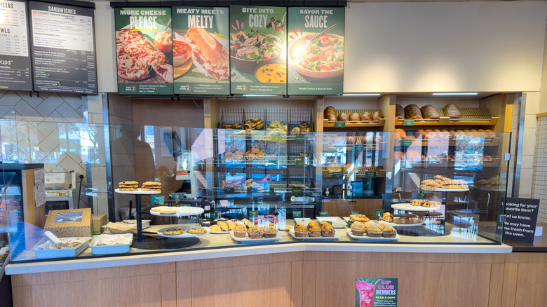 Panera counter with baked goods on display, no one working behind counter