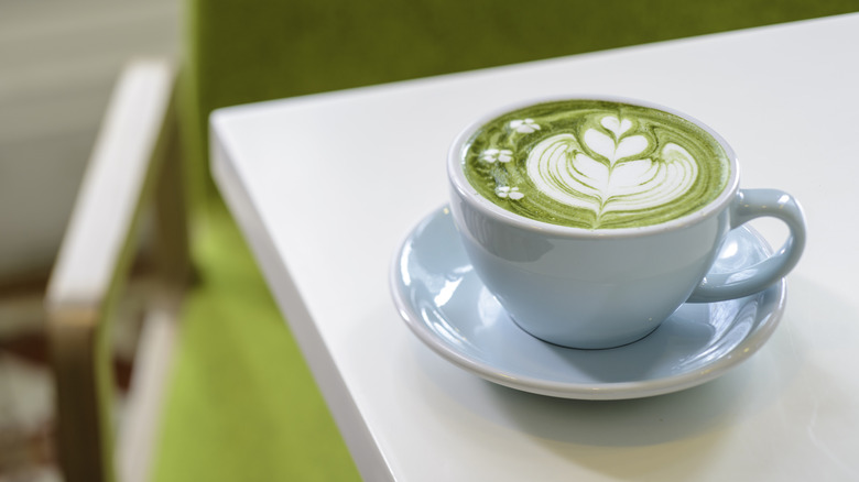 Matcha latte in a mug on white countertop