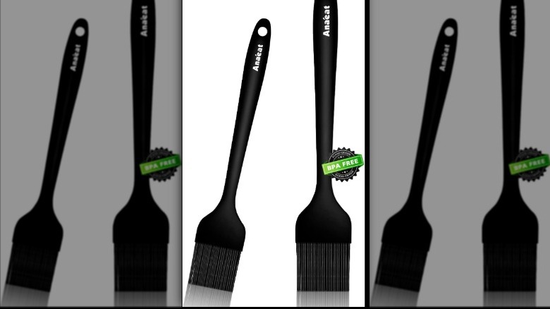 Two silicone brushes rest side by side.