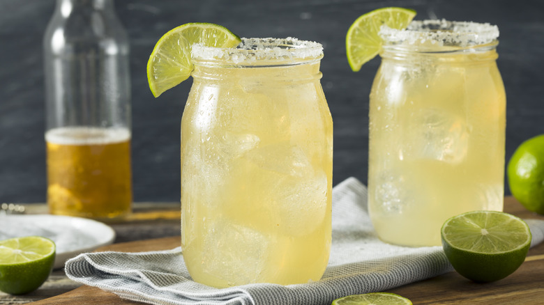 two beergaritas with limes