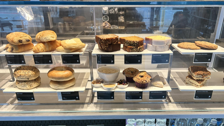 Starbucks display, showing loaves, bagels, and other pastries.
