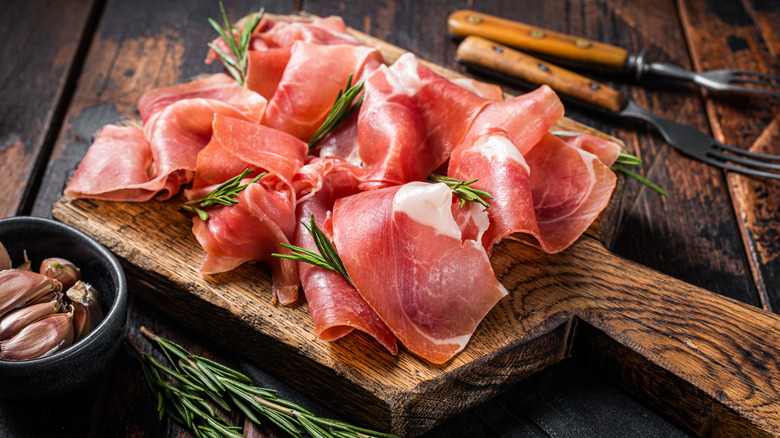 Prosciutto on a wooden board