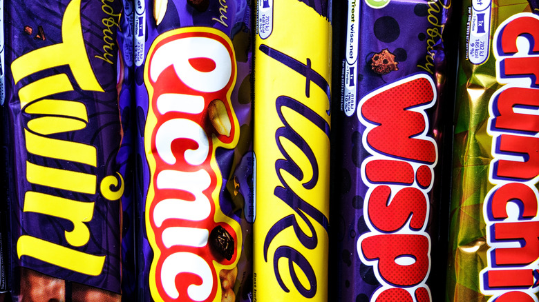 Closeup of Twirl, Picnic, Flake, Wispa and Crunchie bars.