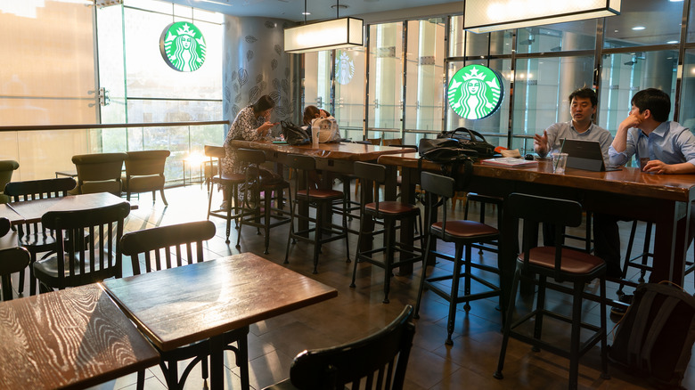 Starbucks cafe interior with wooden tables