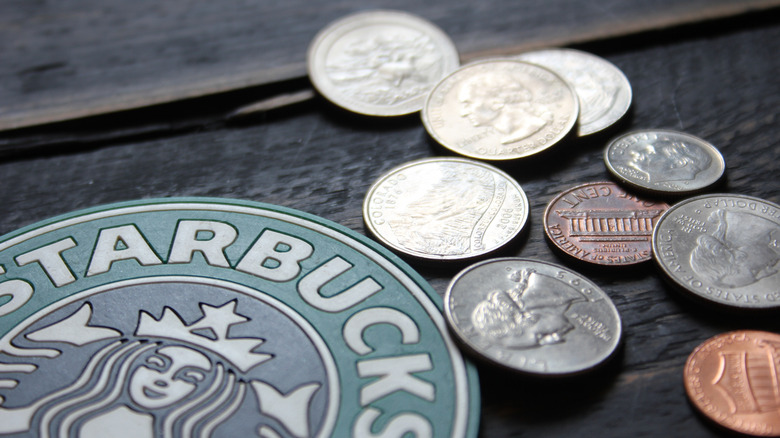 US currency next to Starbucks logo