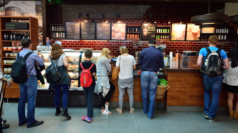 lineup of customers at Starbucks inside the cafe