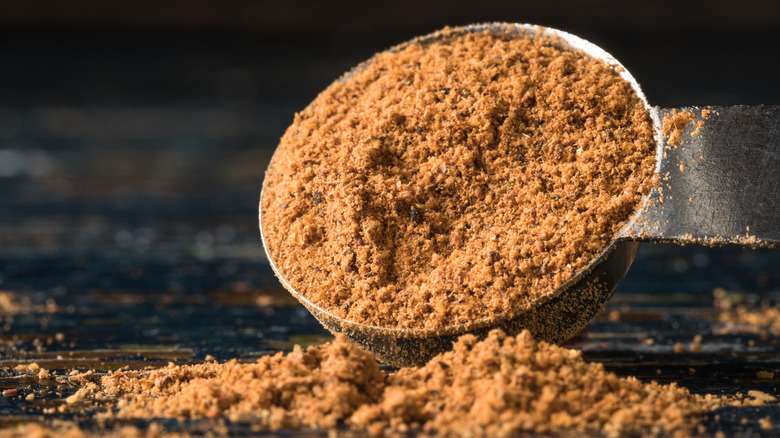 Jerk seasoning poured from a spoon