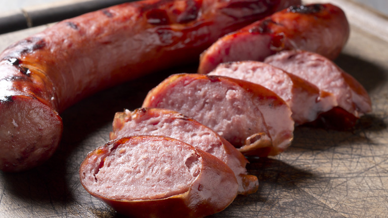 Grilled kielbasa on a cutting board