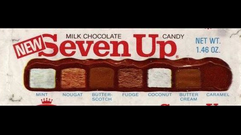 Closeup of Seven Up candy bar ad showing cross-section of candy bar with all seven flavors inside
