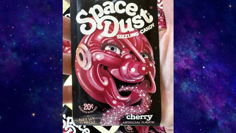 A packet of cherry Space Dust Sizzling Candy, over a nebula background