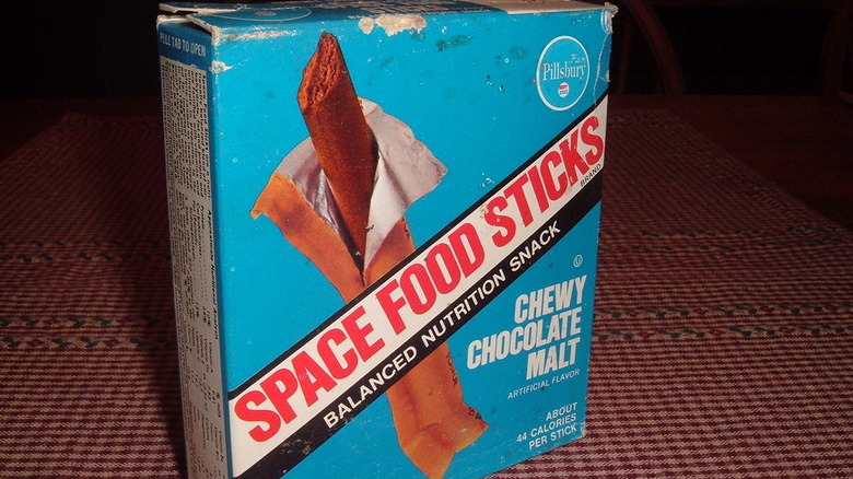 Angled box of Chewy Chocolate Malt Space Food Sticks on a checkered tablecloth