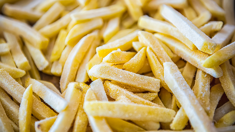 Close-up of frozen uncooked french fries