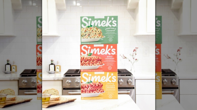 Three of Simek's frozen lasagna offerings stacked one on top of each other.