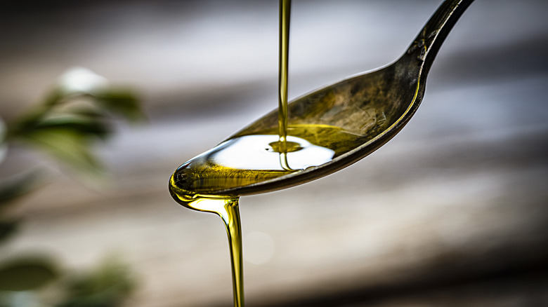 Oil pouring into spoon