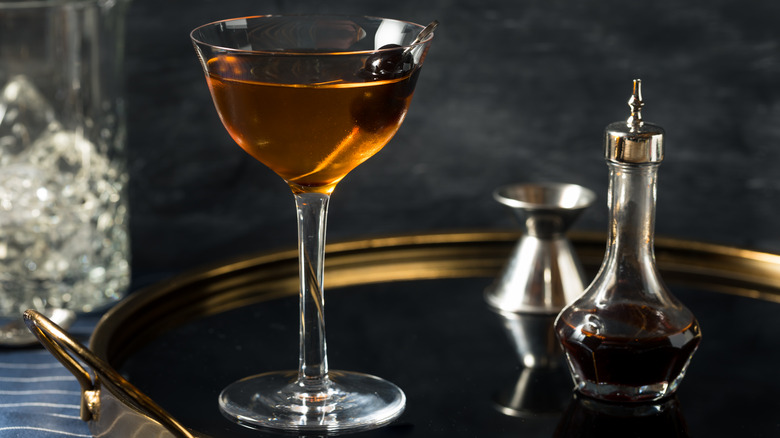Widow's Kiss in glass with cherry garnish