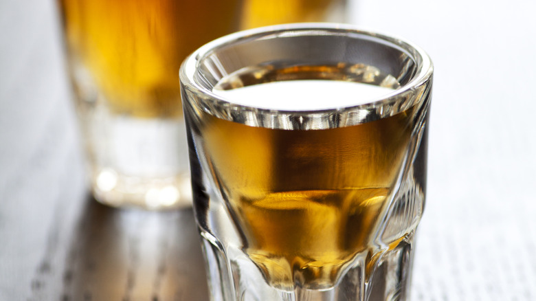 shot glass full of liquor