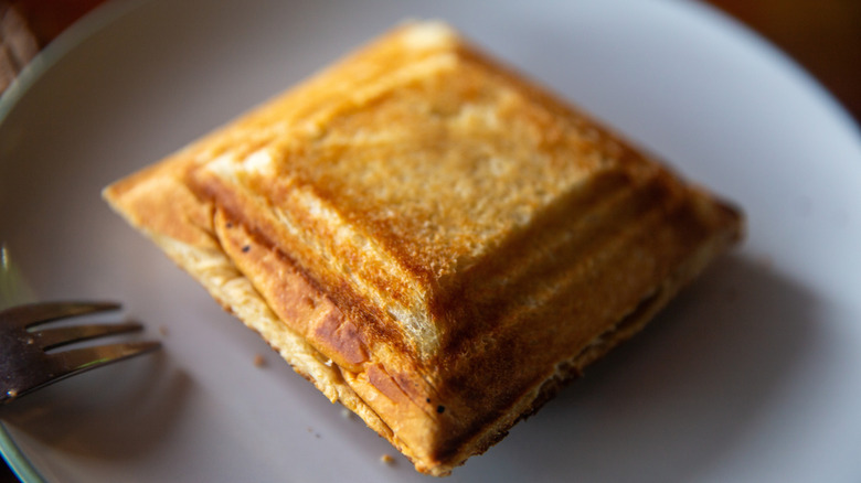 Toasted Jaffle sandwich on a white plate