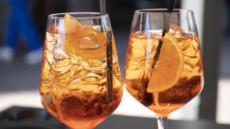 Two Aperol Spritz cocktails with orange slices