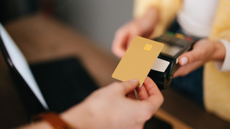 closeup of woman using a credit card