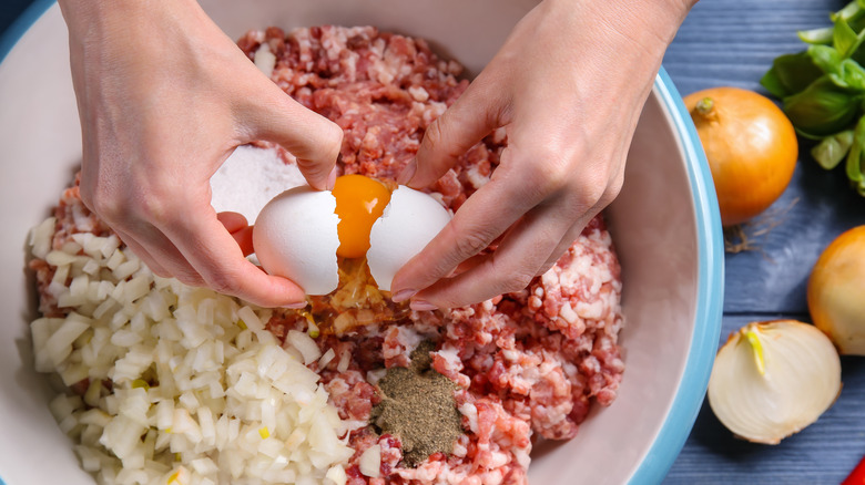 adding egg to meatloaf mixture