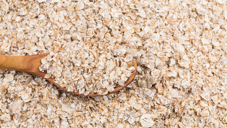 fine oatmeal on a wooden spoon