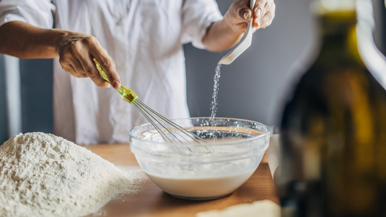 Cook preparing dough