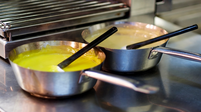 Two saucepans left out on kitchen surface