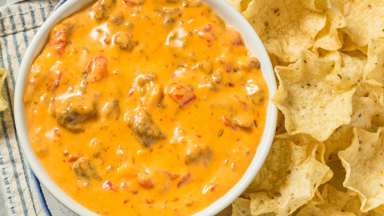 Queso sauce with added ingredients and chips