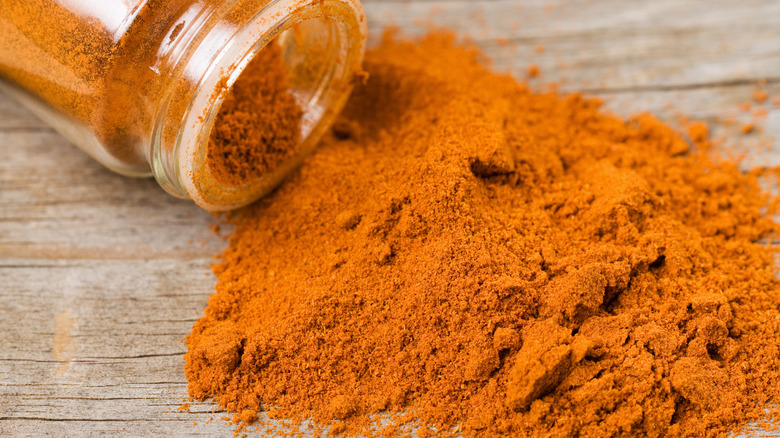 Cayenne pepper spilling onto table