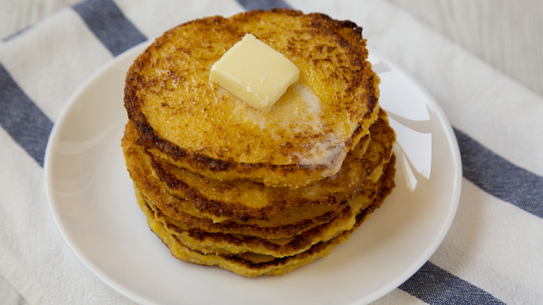 Stack of johnnycakes on striped tablecloth