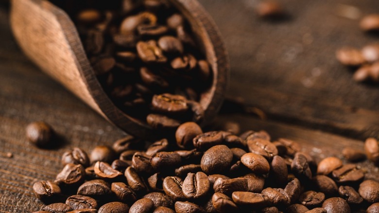 coffee beans with wooden spoon