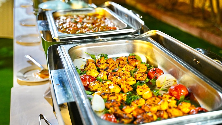 Dishes on serving trays on a buffet