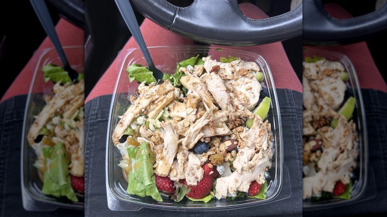 Chick-fil-A salad in container topped with chicken