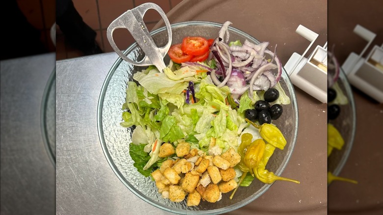 Olive Garden House Salad in a bowl with cheese grater
