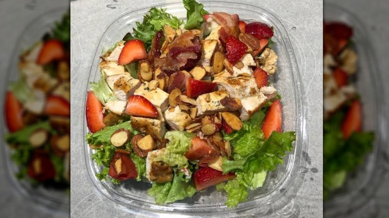 A Wendy's strawberry salad in a plastic container