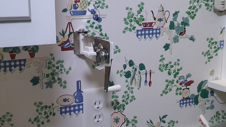 a retro wall mounted can opener.