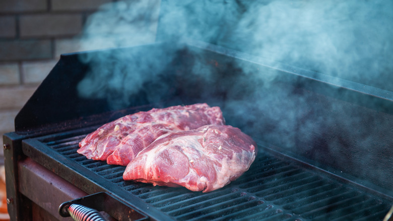 Pork meat steaks on the grill