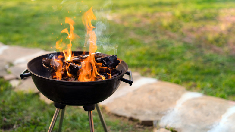 Wood burning on a barbecue grill