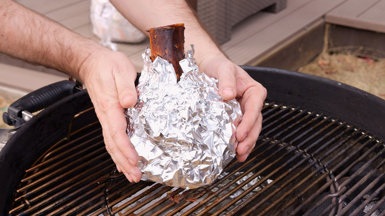 Wrapped meat on a grill