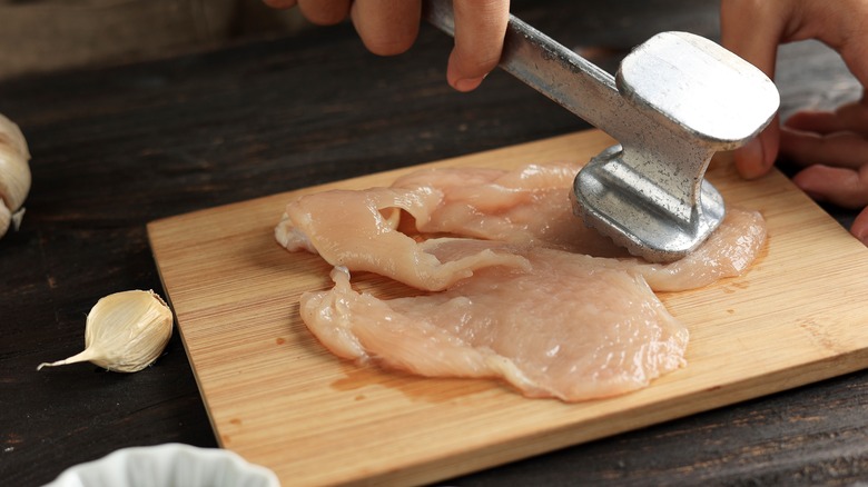 Chicken breast and meat mallet
