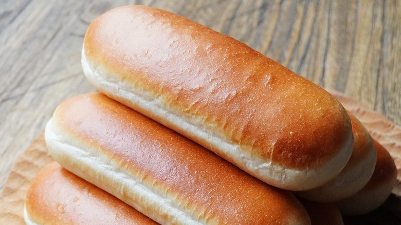 Baked hot dog buns stacked together