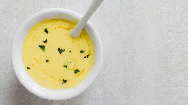 Aioli in white ceramic bowl with spoon