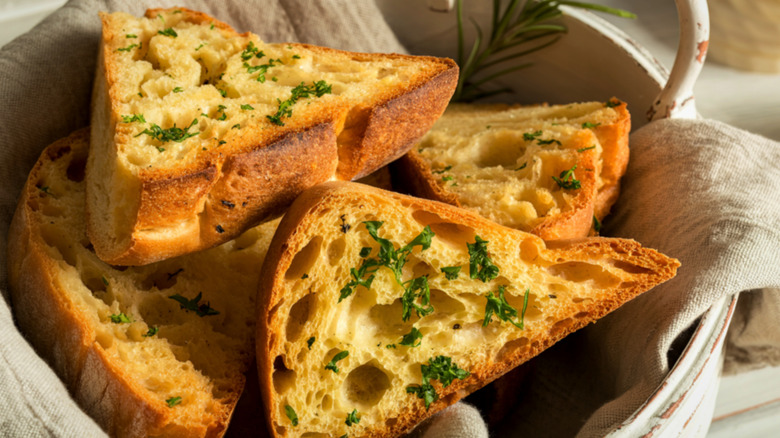 Wedges of garlic bread in a basket
