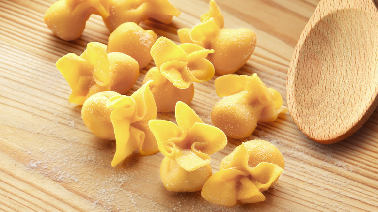 fresh fagottini with wooden spoon